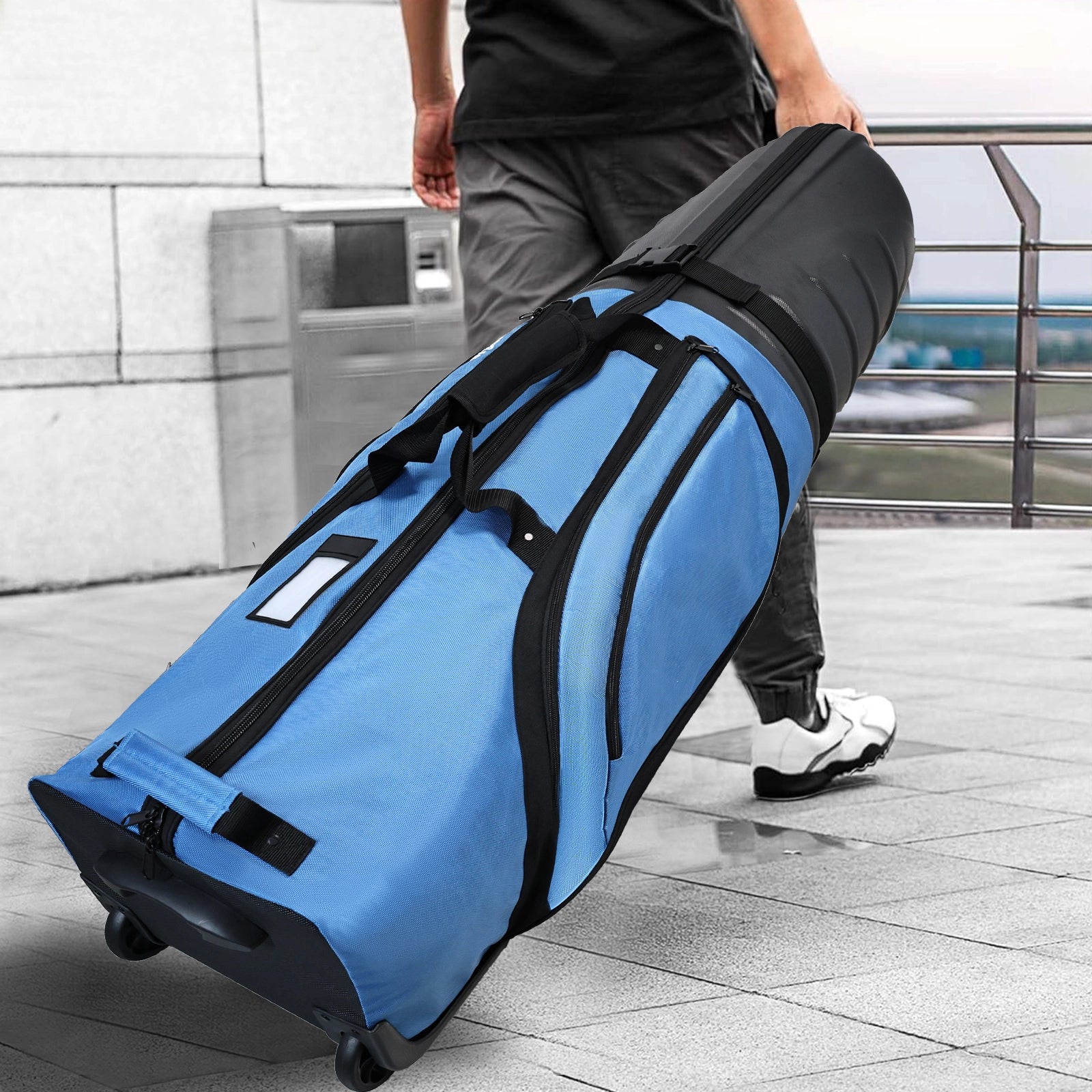 Yamato hard shell golf case on airport conveyor belt - Meets IATA size standards