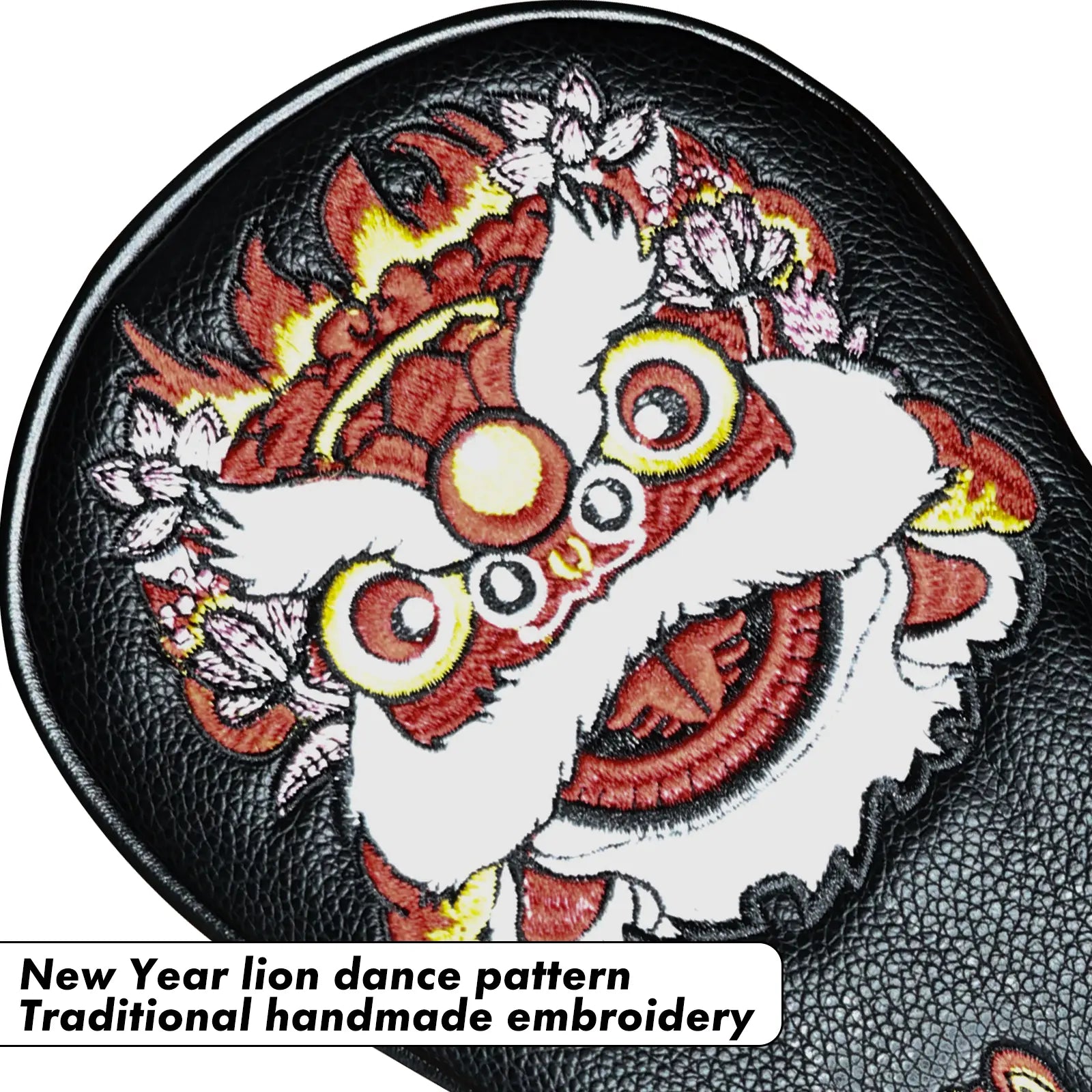 Close-up of lion embroidery on Yamato black golf head cover