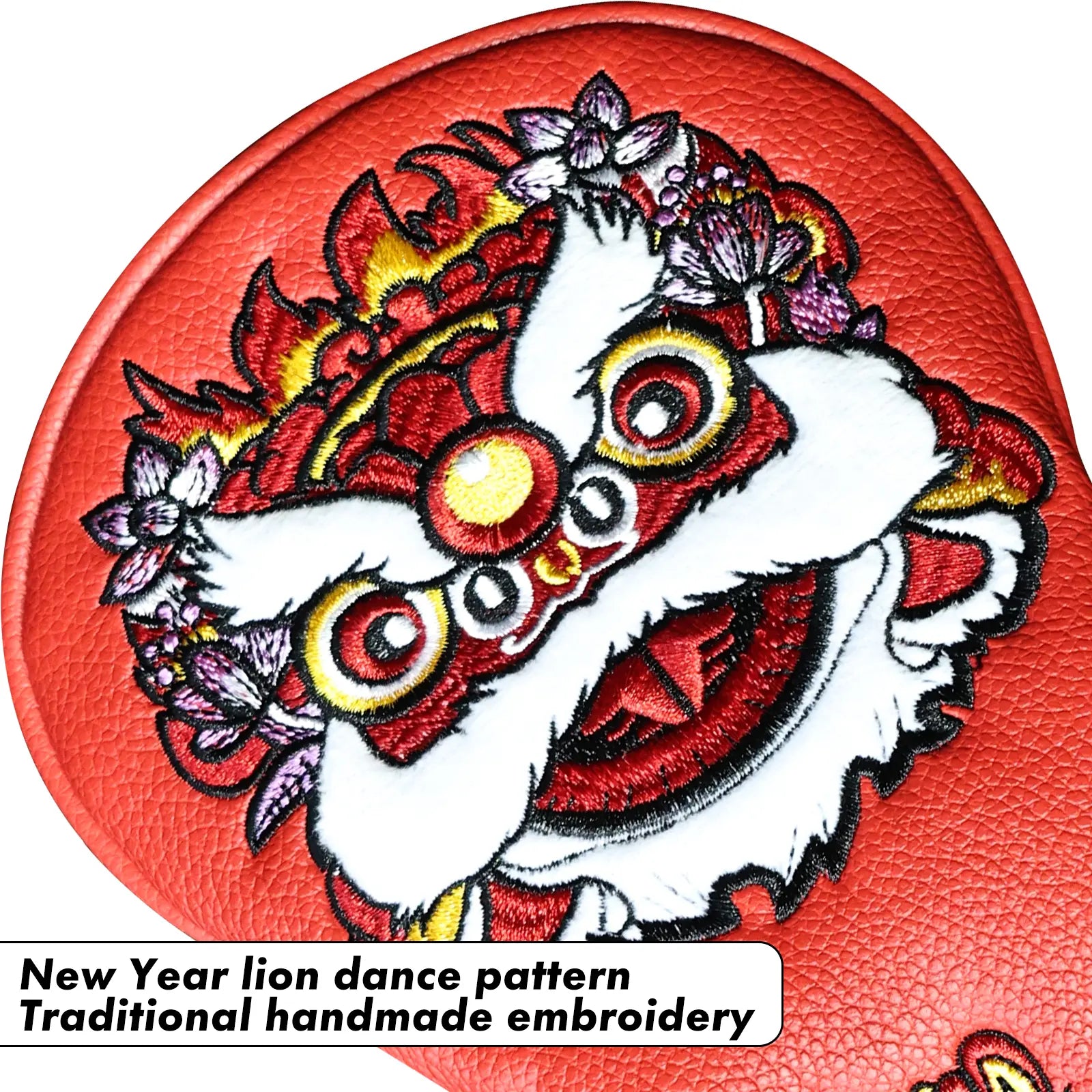 Close-up of lion embroidery on Yamato red golf head cover