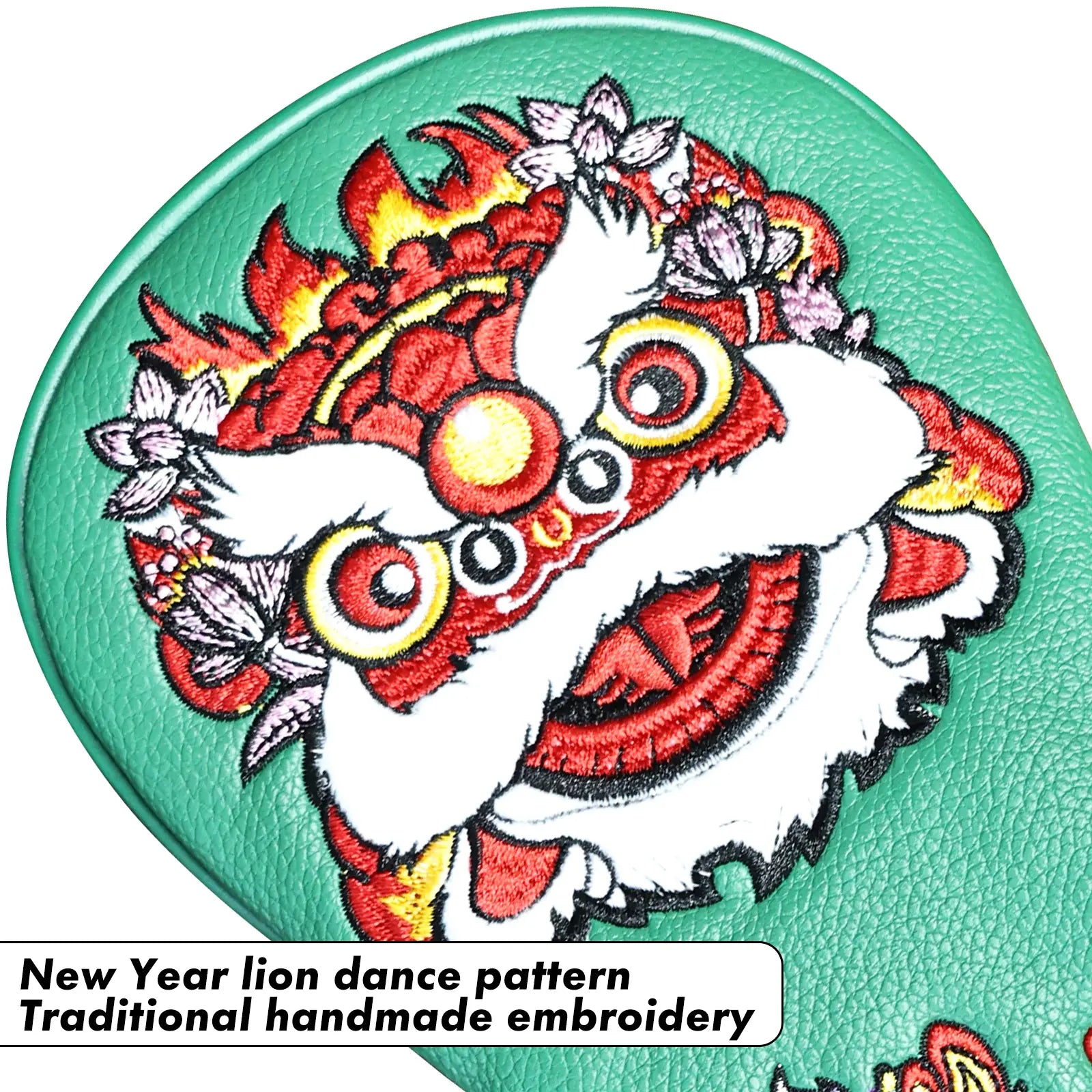 Close-up of lion embroidery on Yamato green golf head cover